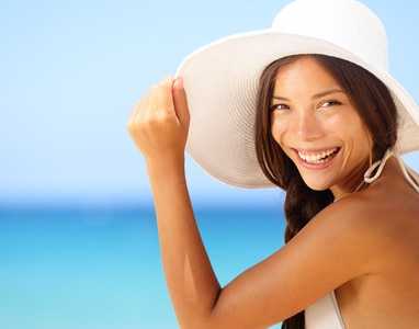 Vacation beach woman smiling happy portrait