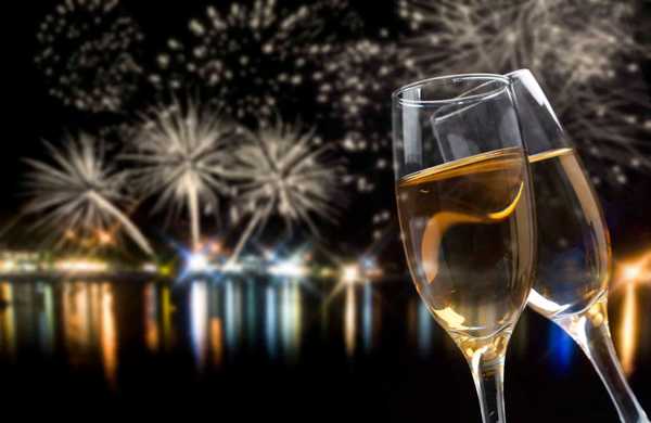 Celebrating New Year with champagne and fireworks